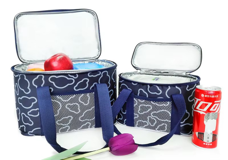 dark blue cloud print cooler bags in two sizes with apple and can