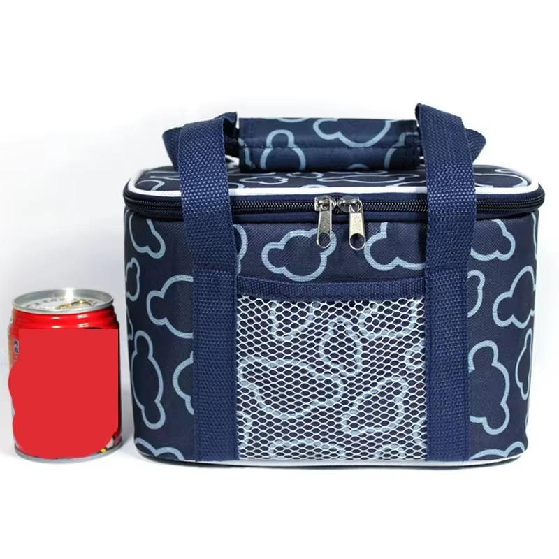 dark blue cooler bag next to soda can