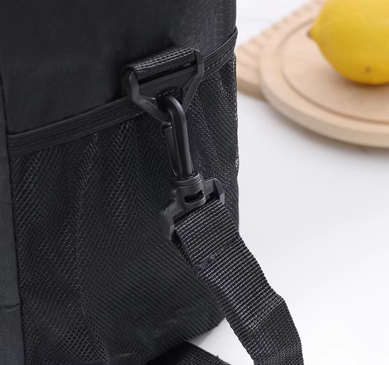 close-up of side mesh pocket and D-ring shoulder strap attachment
