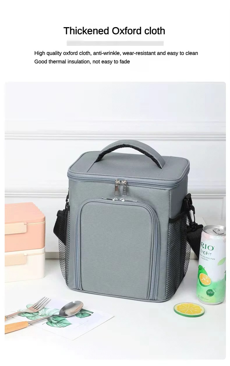 thickened oxford cloth close-up with lunch boxes and a drink can beside gray bag