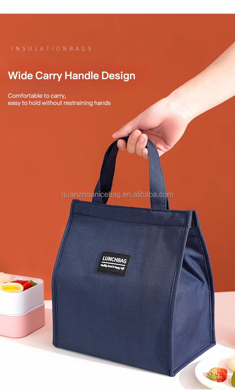 hand carrying navy bag by wide handle wide carry handle design caption