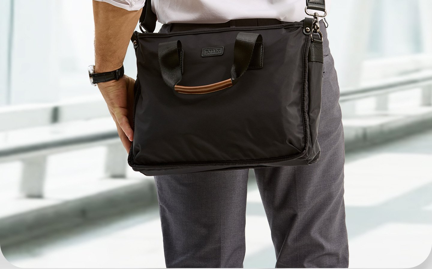bag held by wooden top handle in commuting business scene
