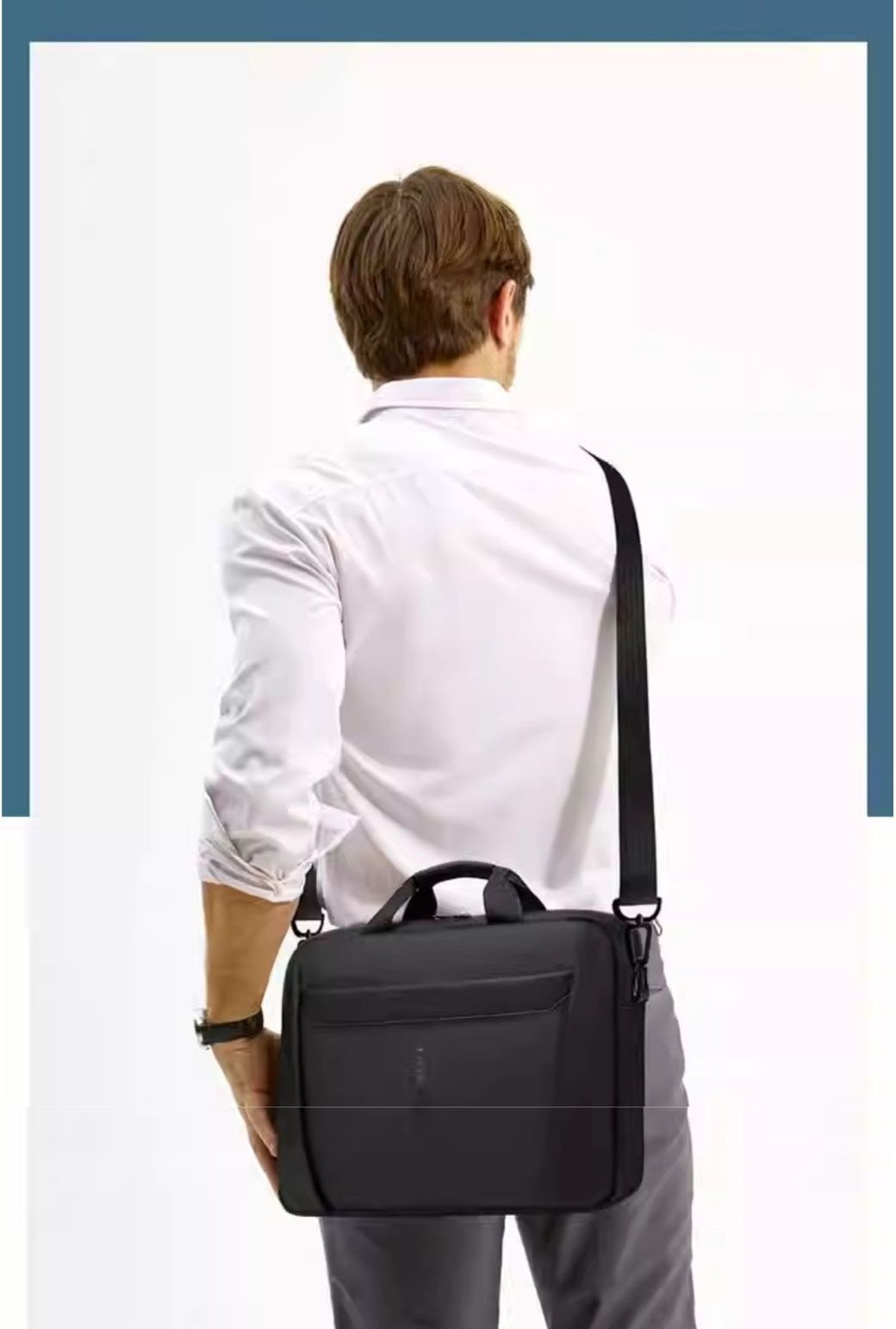 man wearing briefcase crossbody over shoulder from behind