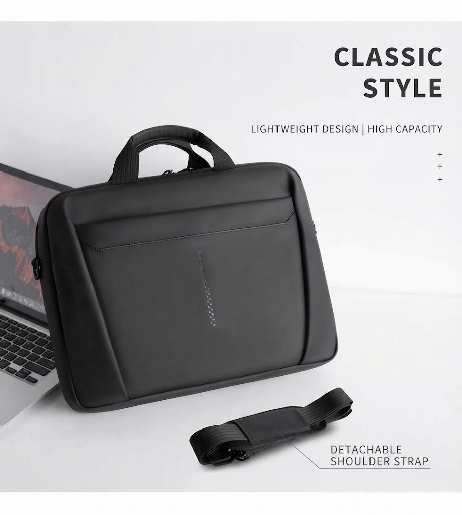 briefcase beside open laptop with detachable shoulder strap