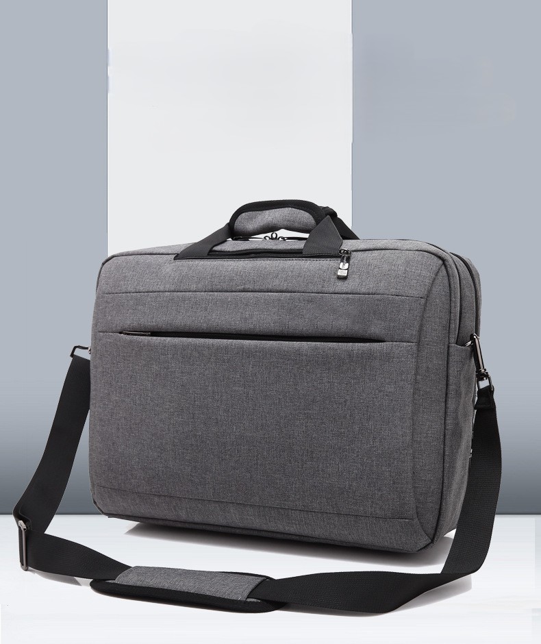 gray briefcase-style front view showing the top handle and shoulder strap