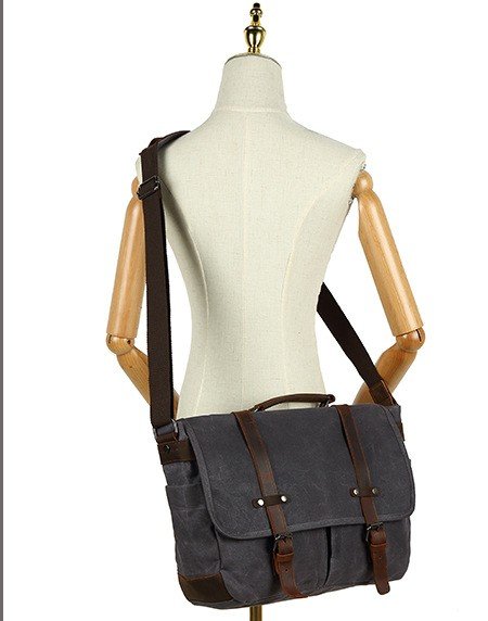 mannequin wearing dark gray bag crossbody from behind