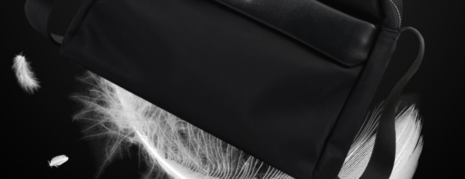 lightweight and breathable text overlay with bag and falling feathers