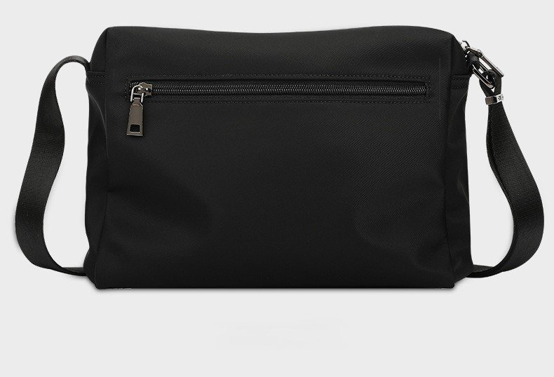 back view of black bag showing zippered rear pocket