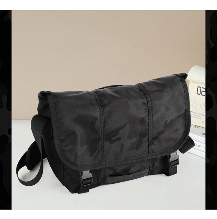 bag resting on desk beside books showing camo texture