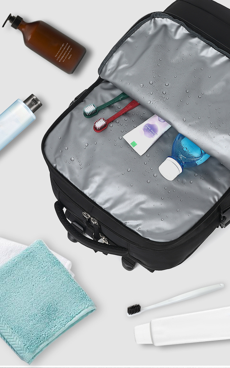 toiletries, a towel and toothbrushes packed in the dry/wet separation pocket
